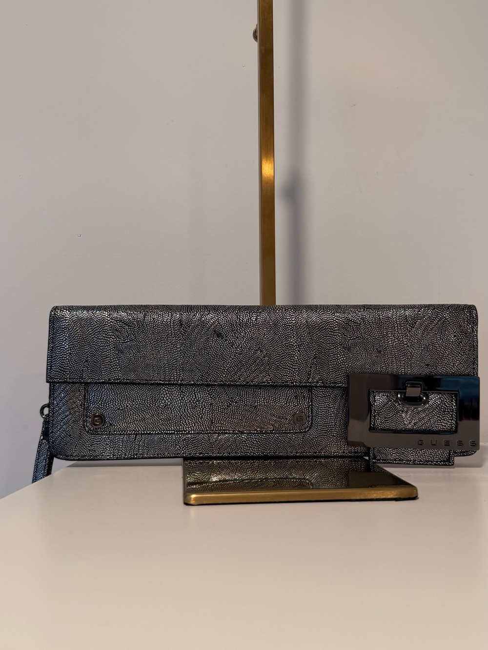 Guess Metallic Silver Textured Clutch with Buckle